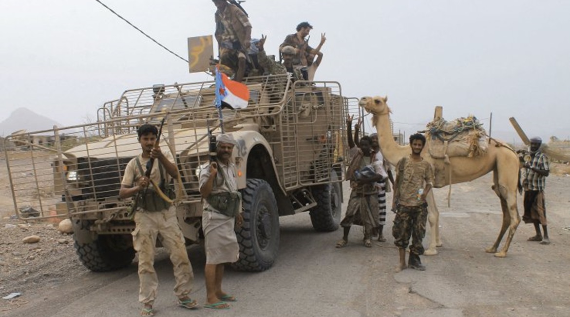 UAE-backed Yemeni forces are seen at Al-Anad Air Base in southern Yemen on 4 August 2015, soon after it was captured from Houthi rebels. The flag on the Oshkosh M-ATV is that of the defunct People's Democratic Republic of Yemen, indicating the fighters...