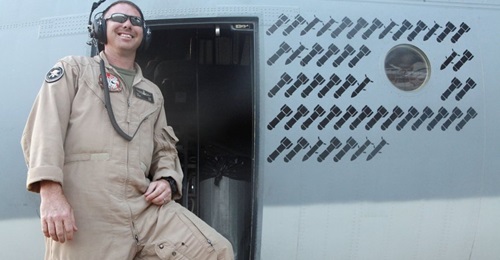 An airman poses next to the operational 'kill' markings stencilled onto the fuselage of a Harvest HAWK in Afghanistan during the war fighting stage of the conflict, giving an indication of the type's work rate in the CAS role. The USMC is now looking t...