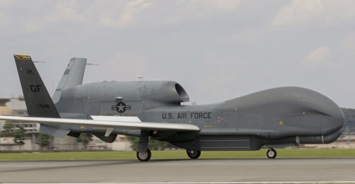 An RQ-4 Global Hawk, assigned to the 319th Operations Group, Detachment 1, Andersen Air Force Base, Guam, lands at Yokota Air Base, Japan, on 30 May. The rotational deployment maintains operations for Global Hawks during months of inclement weather end...