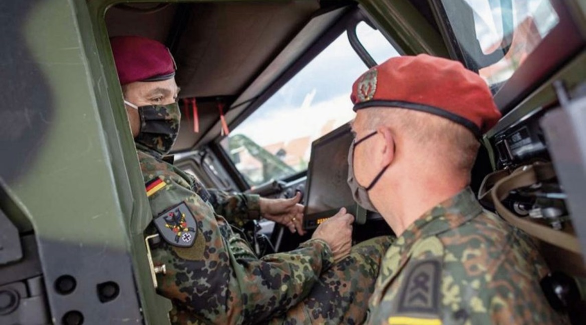 German Army chief Lieutenant General Alfons Mais (left) inspects the service's new BMS in an Eagle command vehicle during the introduction of the system in Frankenberg.