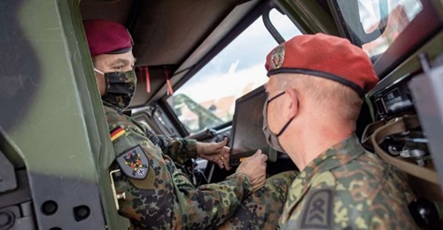 German Army chief Lieutenant General Alfons Mais (left) inspects the service's new BMS in an Eagle command vehicle during the introduction of the system in Frankenberg.