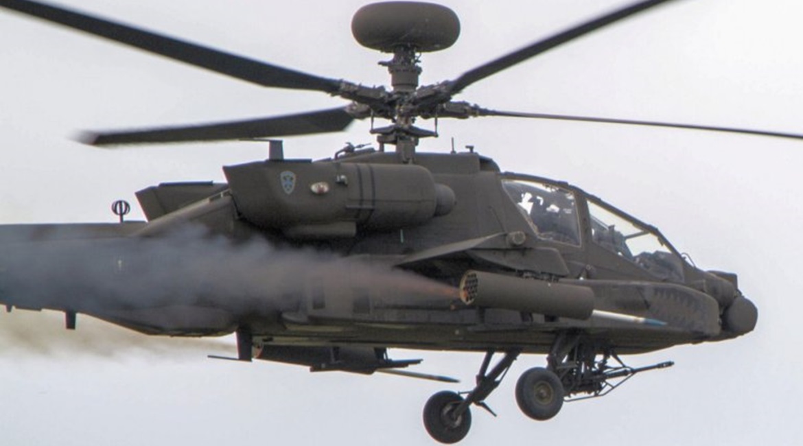 An Apache helicopter launching a Hydra 70 rocket. This weapon can be used as either an unguided air-to-surface munition or with the APKWS kit as a laser-guided munition.