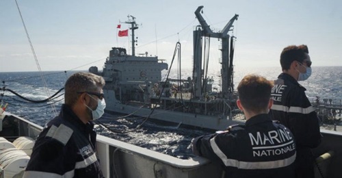 The Turkish tanker 
        
         refuels the French frigate 
        
         off Libya on 4 June.