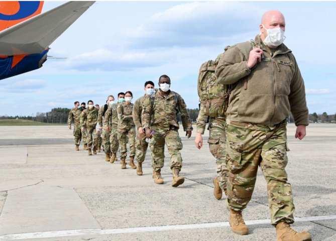 US Army Reserve Soldiers assigned to Urban Augmentation Medical Task Forces arrive at Hanscom Air Force Base, Massachusetts on 17 April, 2020. Officials with the Pentagon’s National Geospatial Intelligence Agency are developing a predictive analysis programme to mitigate future Covid-19 outbreaks. (Credit: US Department of Defense)