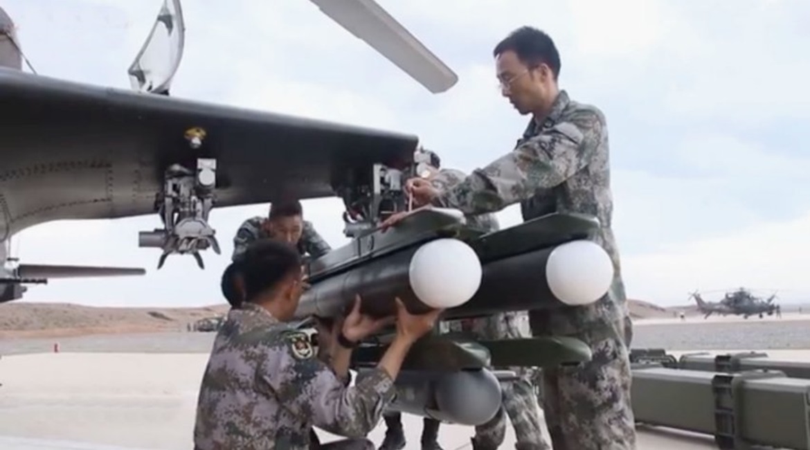A screengrab from CCTV 7 footage released online on 6 August showing two units of a new ATGM being loaded onto one of the launchers of a PLAGF Z-10 attack helicopter. The launcher is also carrying what appears to be a pod.