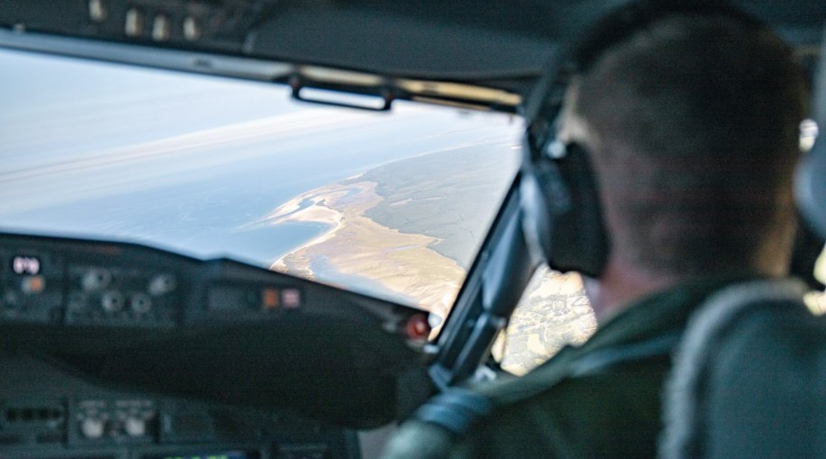 The view from the cockpit of an RAF P-8 flying a mission over the English Channel to monitor migrants.