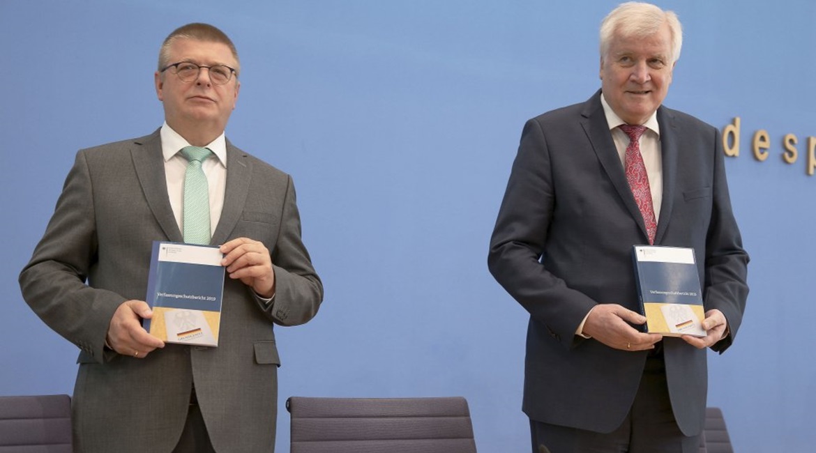 German Federal Minister of the Interior Horst Seehofer (right) and Thomas Haldenwang, president of the Federal Office for the Protection of the Constitution (Bundesamt für Verfassungsschutz: BfV), attend a news conference on 9 July 2020 in Berlin,...