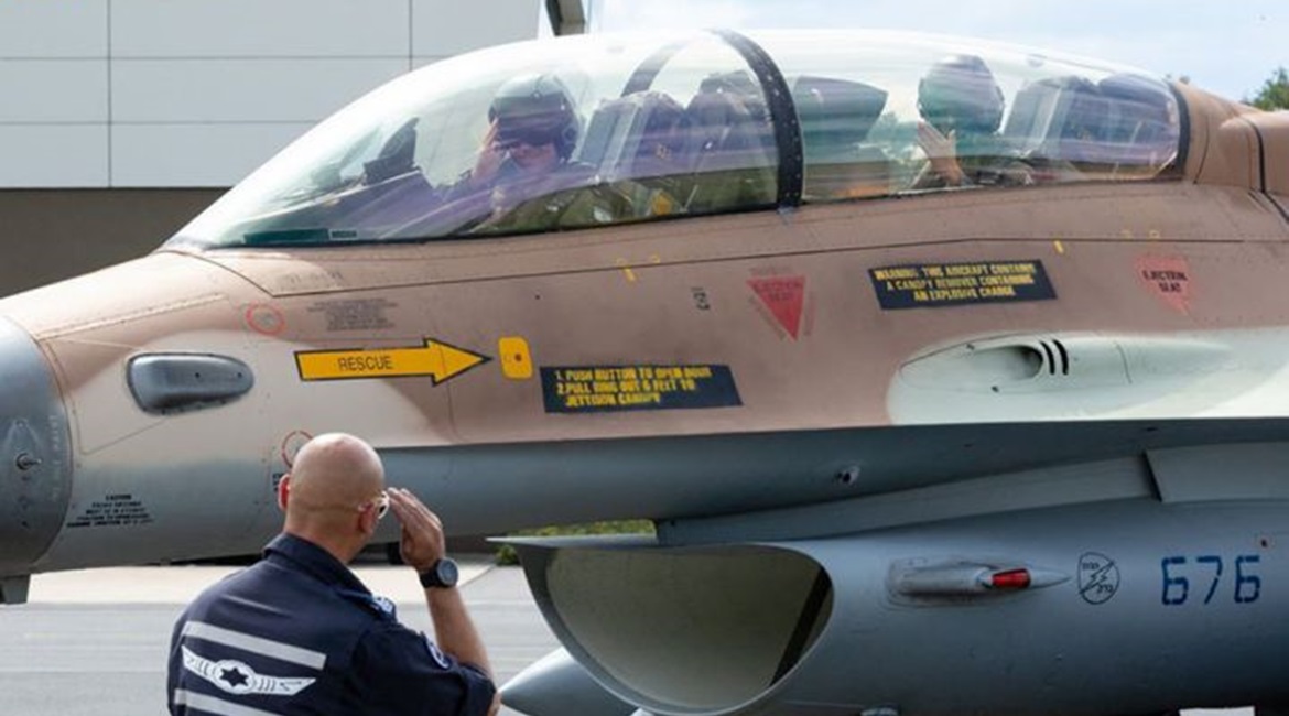 IAF F-16D crewmembers are greeted by an Israeli ground handler on their arrival into Germany for the first time in Israel's history.