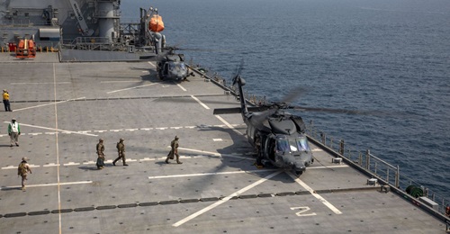 US personnel board an Emirati UH-60L Black Hawk that landed on USS 
        
         during a live-fire exercise in the Gulf on 11 August.
