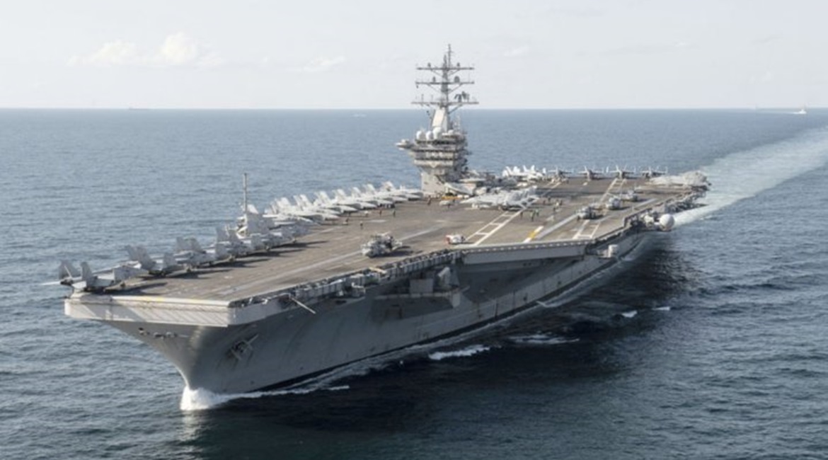 Aircraft carrier USS 
        
         (CVN-69) spent 18 months in a maintenance availability ending in 2019. The work was initially scheduled to take only six months.
