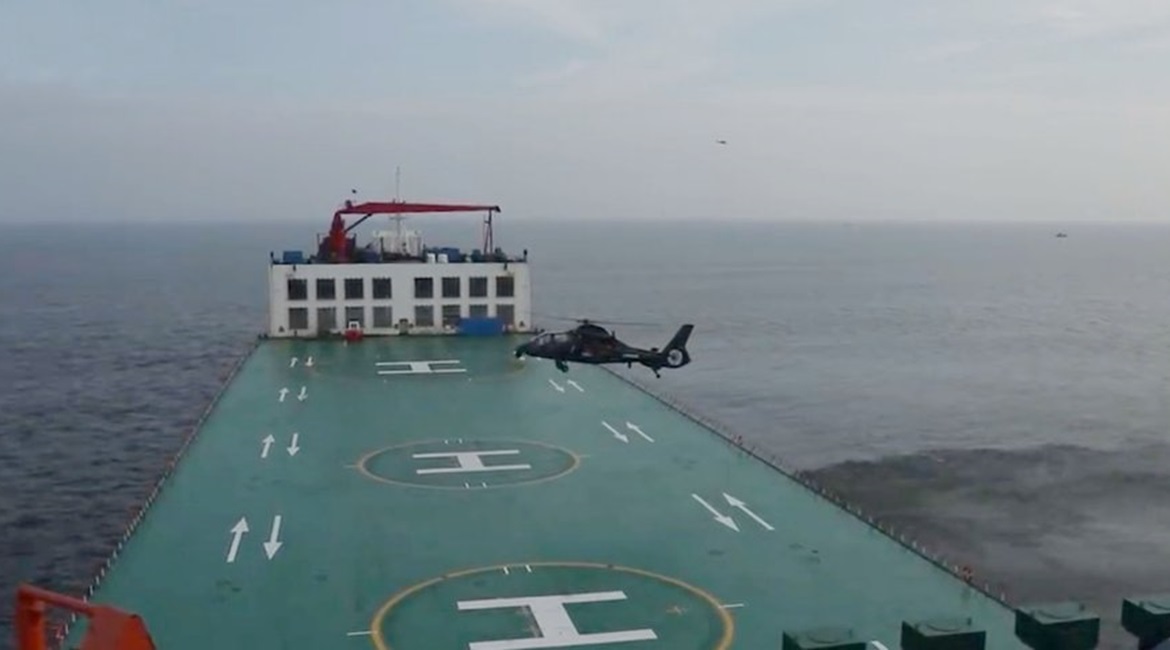 A screengrab from CCTV 7 footage released on 19 August showing a PLAGF Z-19 helicopter about to land on a commercial semi-submersible ship as part of an exercise.