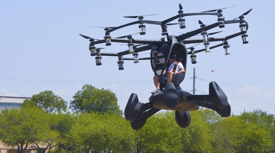 Matt Chasen, Lift Aircraft chief executive officer, pilots the Hexa electric vertical takeoff and landing (eVTOL) aircraft over Camp Mabry, Texas on 20 August 2020. Notice the six vertical perimeter floats.