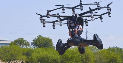 Matt Chasen, Lift Aircraft chief executive officer, pilots the Hexa electric vertical takeoff and landing (eVTOL) aircraft over Camp Mabry, Texas on 20 August 2020. Notice the six vertical perimeter floats.