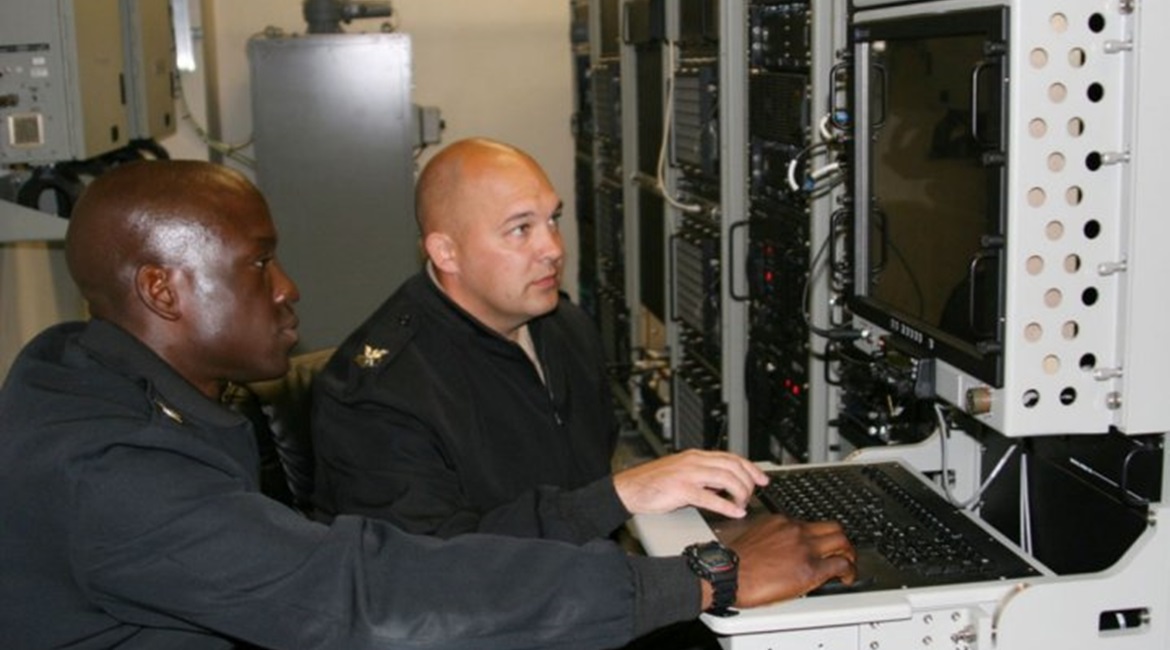 US Navy Cryptologic Technician (Collection) First Class Irving Juleus and Cryptologic Technician (Collection) First Class Terrance Krueger use a collections suite during a training operation on 6 April 2016 in San Diego, Calif. Navy leaders plan to tra...