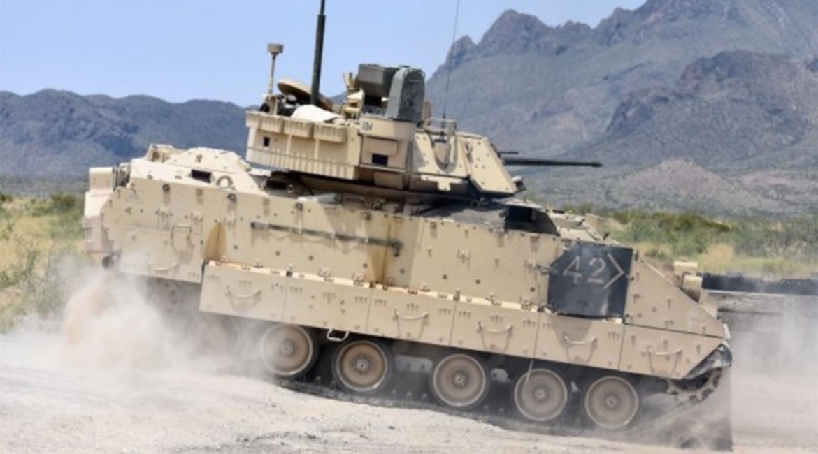 A M2A3 Bradley Fighting Vehicle crew changes position on the range during a gunnery training event in 2018. The US Army plans to issue a final RFP for its revamped Bradley replacement effort in December.