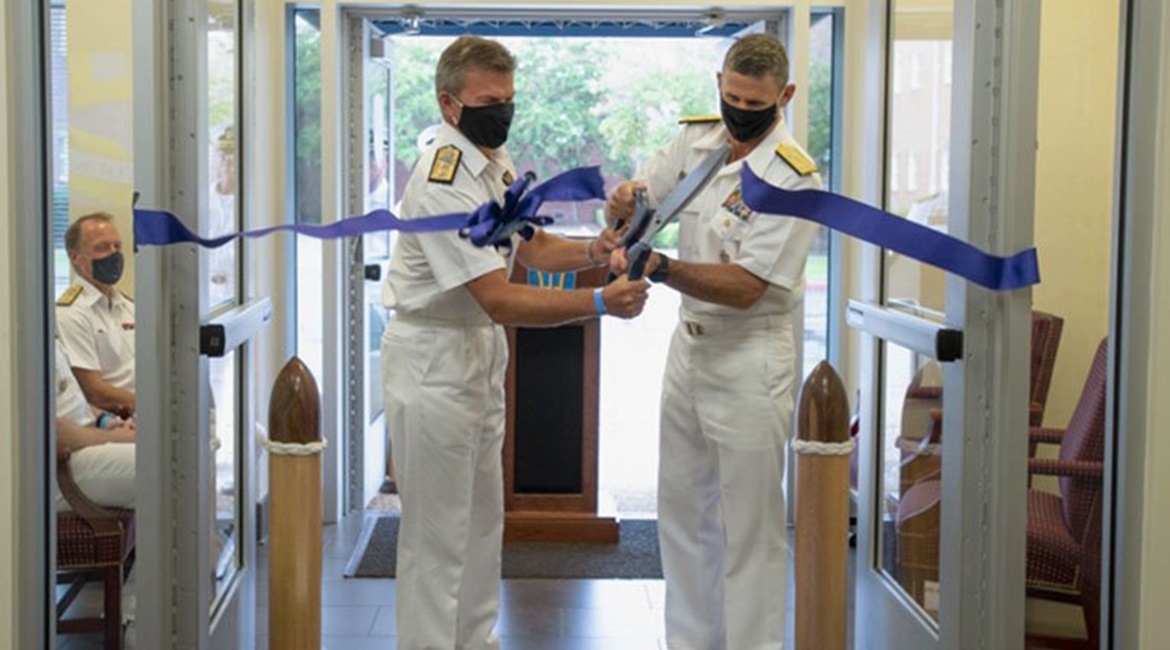 JFC Atlantic commander US Vice Admiral Andrew Lewis (right) and his deputy, UK Royal Navy Rear Admiral Andrew Betton cutting the ribbon during the new command's IOC ceremony.