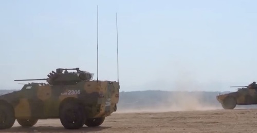 The green-brown camouflage on the AFV, which had previously been seen painted in blue, appears to be identical to the one seen on a similar-looking multirole armoured vehicle that entered service with the corps in May.