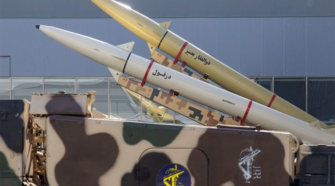 A Zolfaghar Basir anti-ship ballistic missile (rear) is seen mounted on a mobile twin-launcher alongside a Dezful missile, the longest-range variant of the Fateh-110 family.