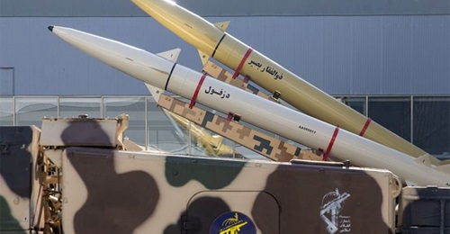 A Zolfaghar Basir anti-ship ballistic missile (rear) is seen mounted on a mobile twin-launcher alongside a Dezful missile, the longest-range variant of the Fateh-110 family.