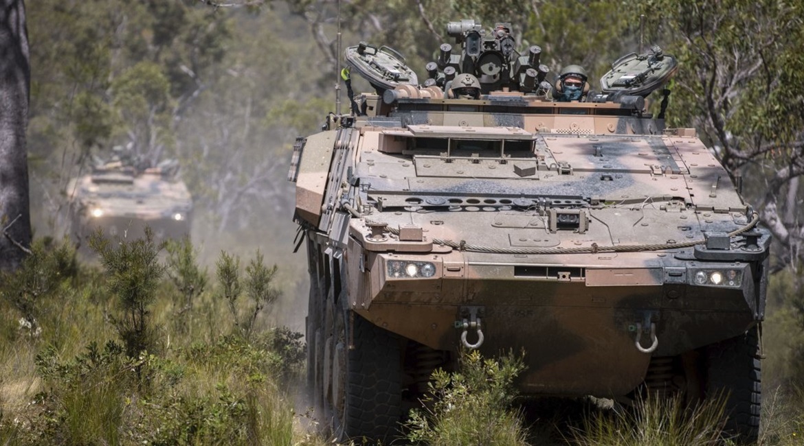 Soldiers from the 2nd/14th Light Horse Regiment of the Queensland Mounted Infantry conduct cross-country training in new Boxer armoured vehicles at the Wide Bay Training Area in Queensland.