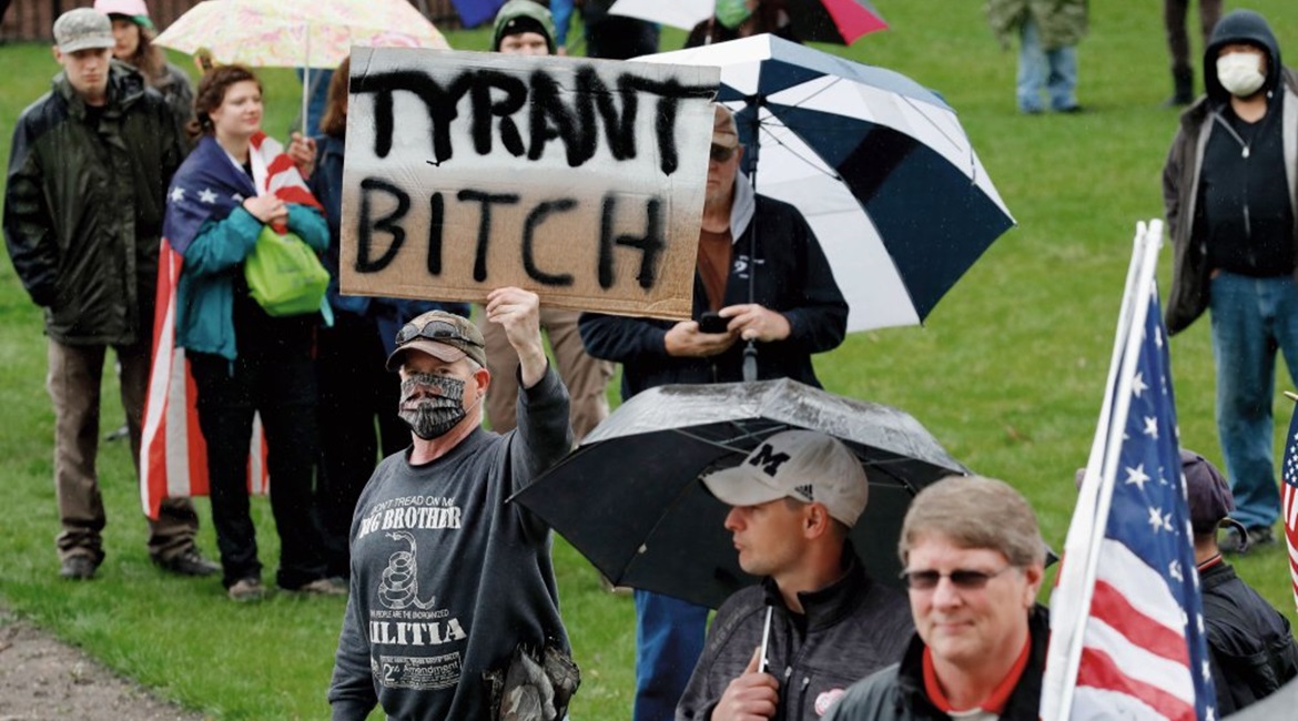 A group of individuals attends an anti-shutdown rally at the Capitol in Lansing in the state of Michigan on 14 May 2020 to protest against Governor Gretchen Whitmer's Covid-19-related restrictions.