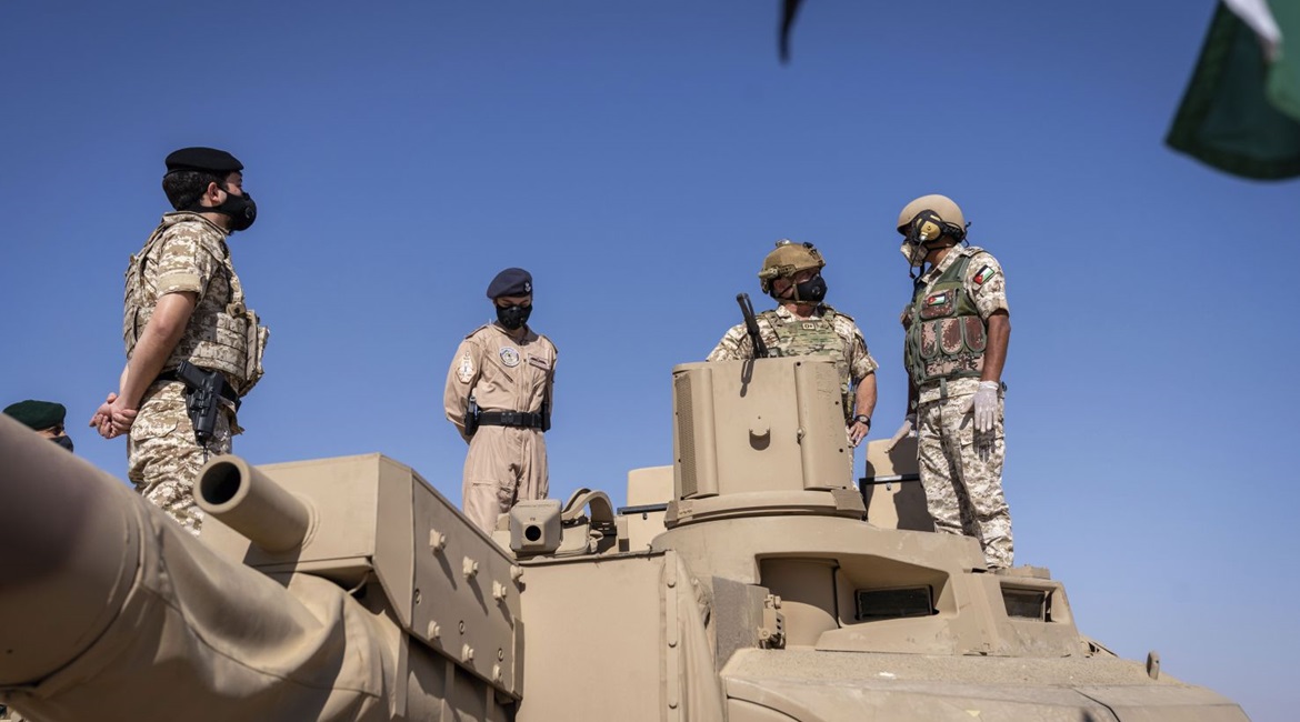 King Abdullah II (centre with helmet), Prince Hussein (left), and Princess Salma (between the two) inspect a Leclerc tank during Exercise 'Salah al-Din Fortress'.