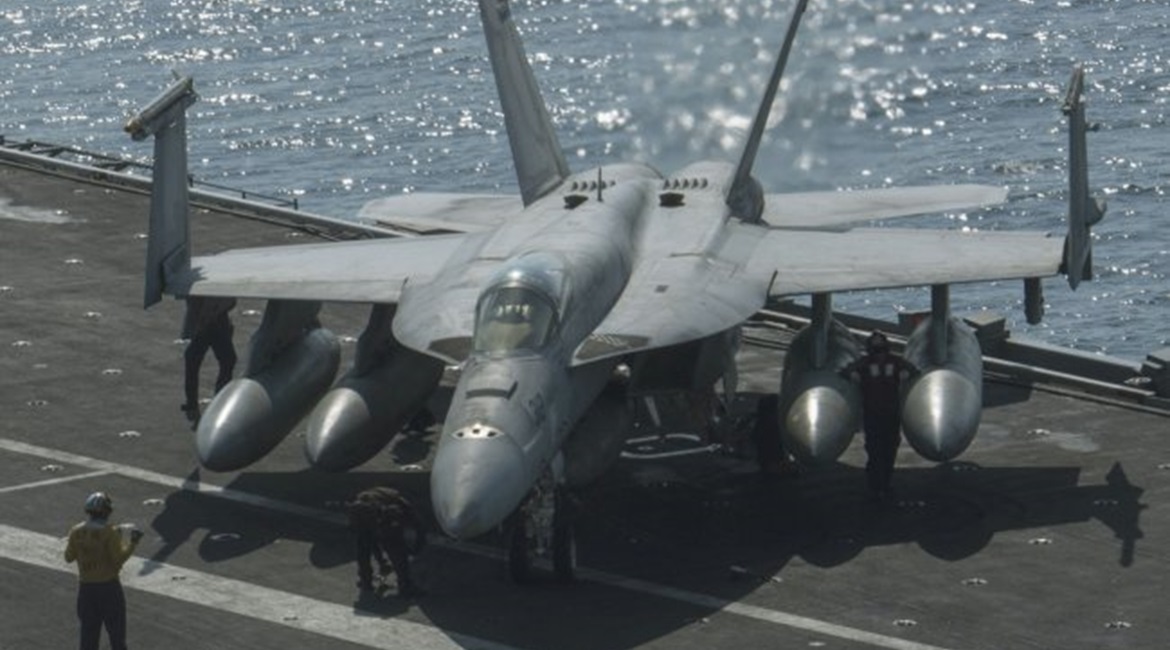 Sailors on 28 October 2020 secure a Boeing F/A-18E Super Hornet, from the “Kestrels” of Strike Fighter Squadron (VFA) 137, on the flight deck of the aircraft carrier USS 
        
         (CVN 68). A F/A-18E crash on 20 October wa...