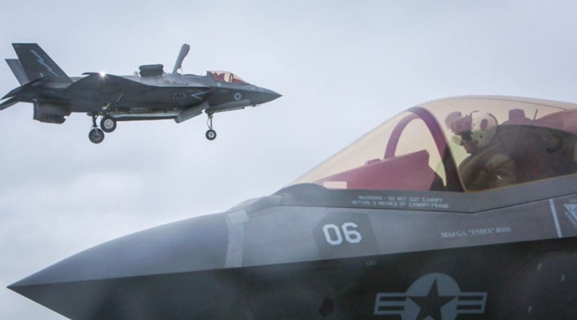 A UK F-35B in the hover prior to landing aboard HMS 
        
         while a USMC aircraft taxies along the flight deck. The commanders of both 617 Squadron and VFMA 211 described the recent joint training mission as being 'seamless' between...