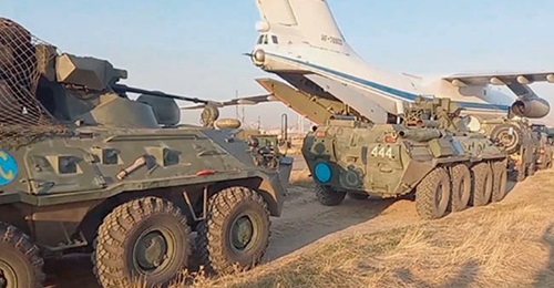 Vehicles from Russia's 15th Independent Motorised Rifle (Peacekeeping) Brigade unloading from Il-76 transport aircraft after arriving in Armenia.