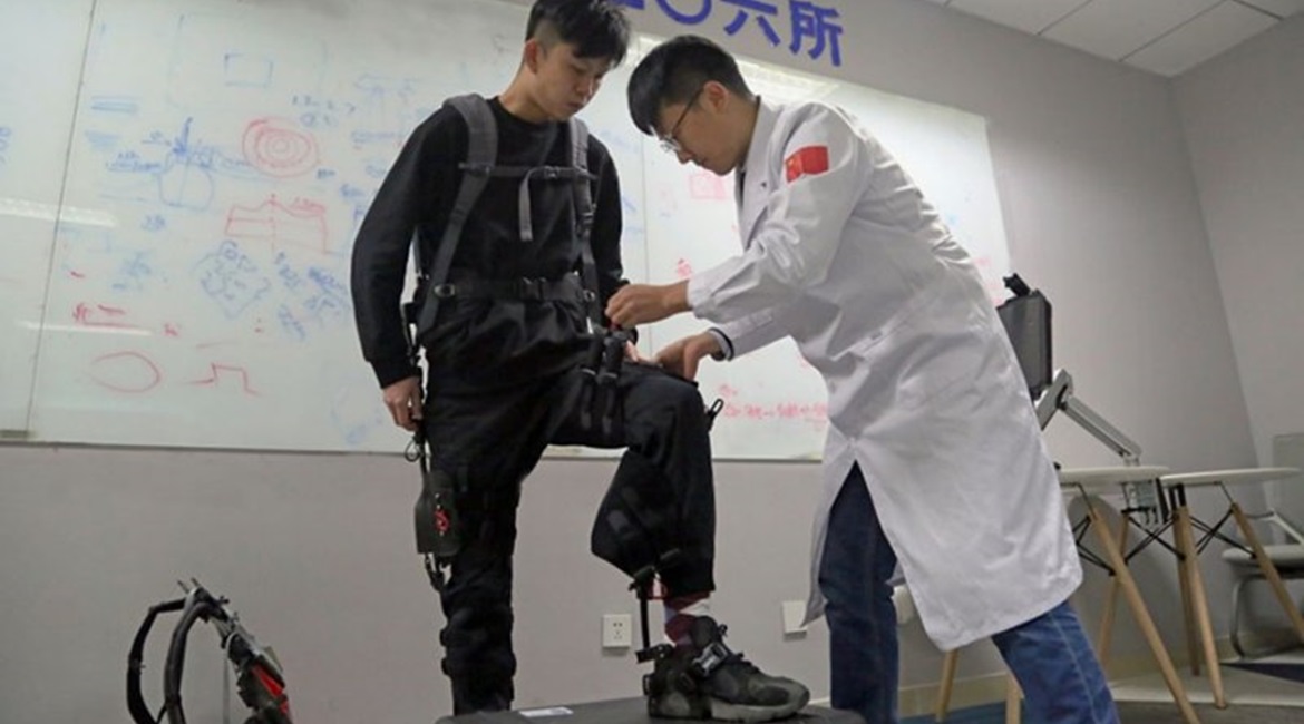 CASIC's recently developed unpowered exoskeleton system is shown here being prepared for a demonstration.