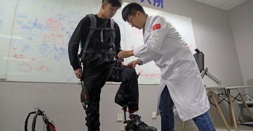 CASIC's recently developed unpowered exoskeleton system is shown here being prepared for a demonstration.