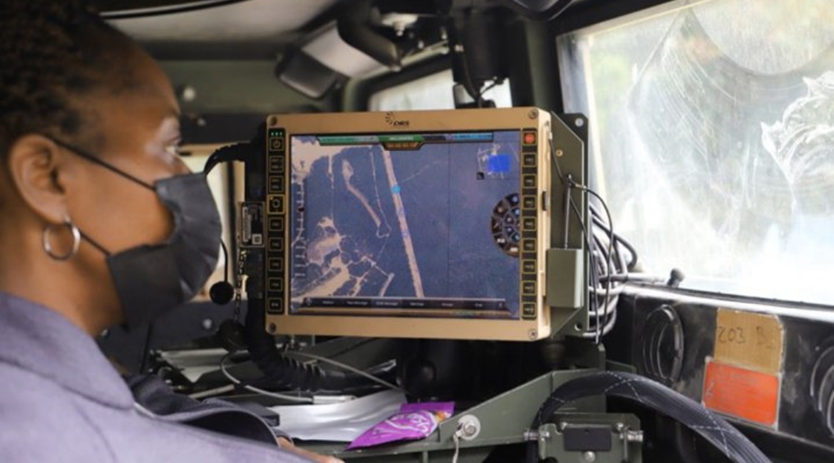 A C5ISR Center electronics engineer studies vehicle positions during Network Modernization Experiment 20 at Joint Base McGuire-Dix-Lakehurst, New Jersey.