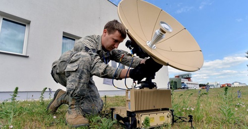 A US Air Force satellite communications technician with the 1st Combat Communications Squadron calibrates a L3 Panther during Baltic Operations 2015 at Powidz Air Base, Poland