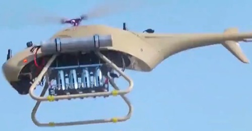A Ziyan Blowfish A2 VTOL UAV in flight fitted with an underslung rack for four mortar bombs.