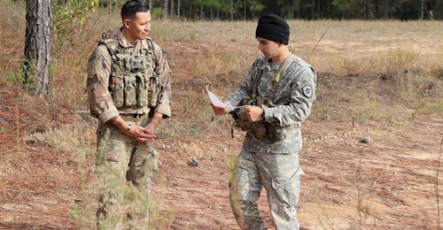 Sergeant First Class Jeremiah Velez, left, an advisor with 3rd Squadron, 1st SFAB, works with a simulated foreign partner during a field training exercise in October 2019 at Fort Benning, Georgia. Soldiers from the 1st SFAB will head to Honduras in Jan...