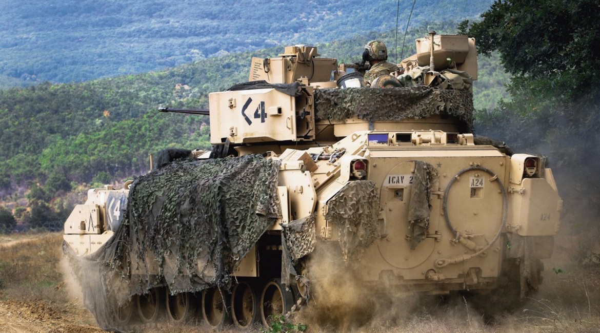 US Army Sergeant Ansel Frayer, sitting in the gunner's turret, and his crew manoeuvre their M2A3 Bradley during a live-fire exercise in Bulgaria in August 2018. The army has announced a tentative roadmap for finding a SK APS for its ground combat vehic...