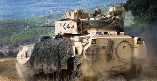 US Army Sergeant Ansel Frayer, sitting in the gunner's turret, and his crew manoeuvre their M2A3 Bradley during a live-fire exercise in Bulgaria in August 2018. The army has announced a tentative roadmap for finding a SK APS for its ground combat vehic...