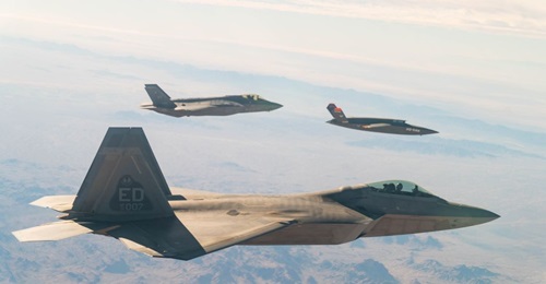 A US. Air Force F-22 Raptor and F-35A Lightning II fly in formation with the XQ-58A Valkyrie UAV over the U.S. Army Yuma Proving Ground testing range in Arizona, during a series of gatewayONE 'fifth generation' connectivity tests on 9 December.