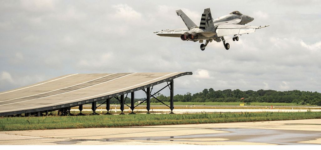 An F/A-18E Super Hornet successfully completes a first ski-jump launch demonstration on 13 August.  (US Navy)