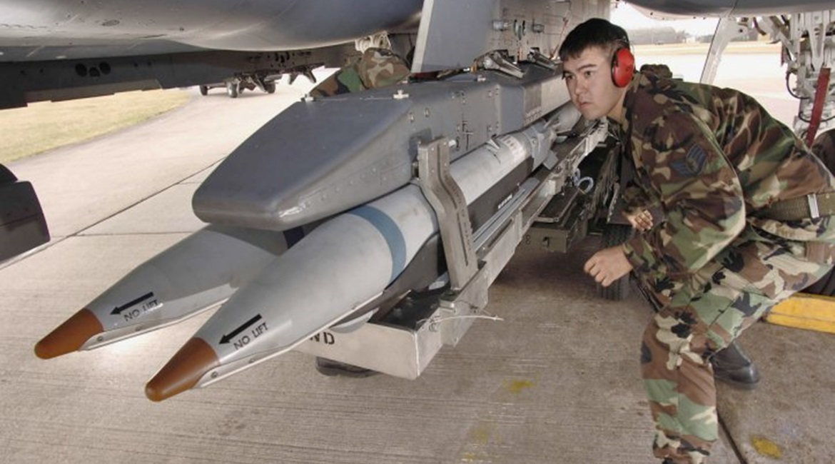 A US Air Force loader seen fitting SDB I bombs to an F-15E combat aircraft. Saudi Arabia is set to carry the munition on its F-15SA aircraft.