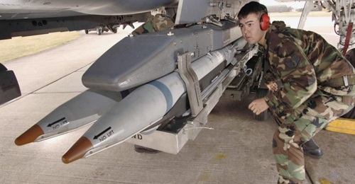 A US Air Force loader seen fitting SDB I bombs to an F-15E combat aircraft. Saudi Arabia is set to carry the munition on its F-15SA aircraft.