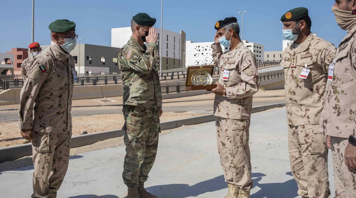 General Brigadier General Keith Phillips, US defense attaché in Abu Dhabi, exchanges gifts with Brigadier General Sultan al-Niyadi during a joint exercise with US marines and the UAE Presidential Guard at the Al-Hamra Combat Training Centre on 16 ...