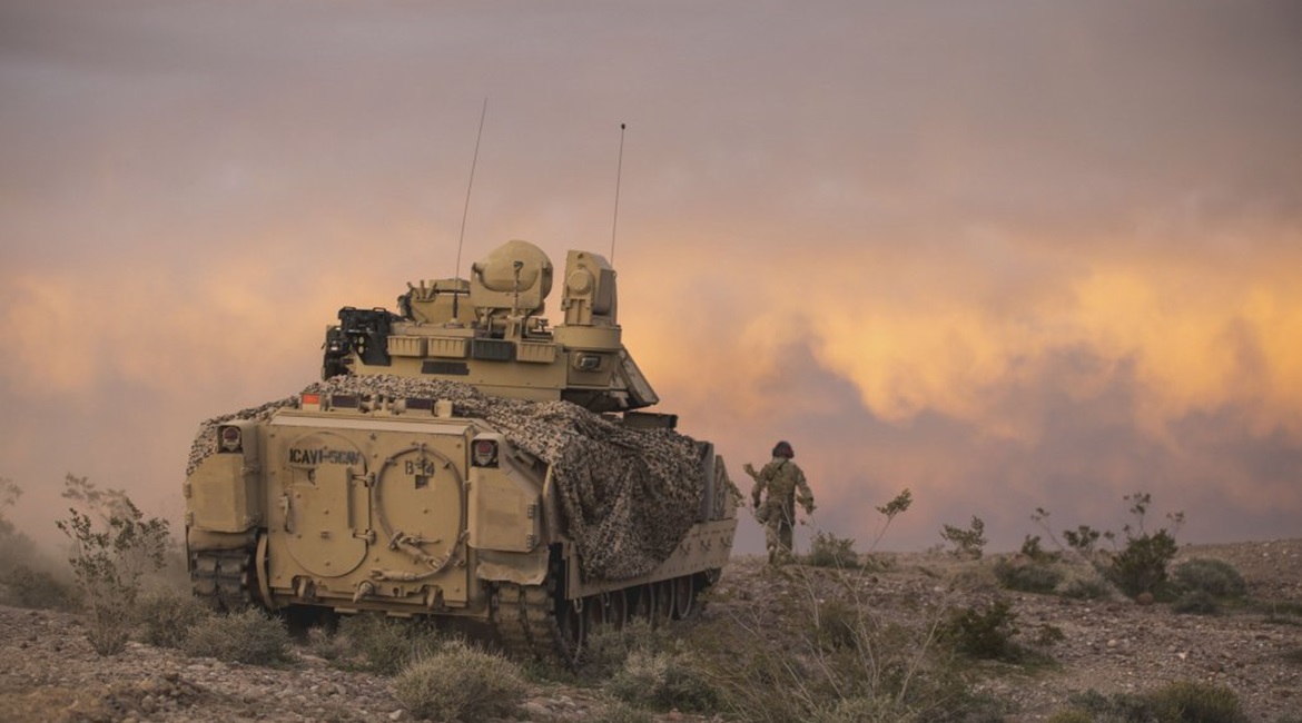 An M2 Bradley fighting vehicle covers dismounted units from 2nd Armored Brigade Combat Team during field exercises at Fort Irwin, California.