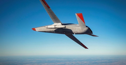A Cobham Mission Systems refuelling pod flies under the left wing of a Boeing MQ-25 unmanned aircraft during a December 2020 test.