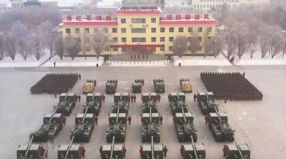 A screenshot from CCTV footage showing a commissioning ceremony for at least 18 Norinco PCL-181 SPHs. The systems entered service with a PLAGF artillery brigade near Tianshan in Xinjiang.
