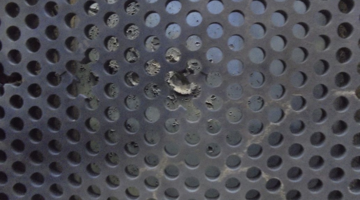This image shows the TESA armour array, the fractured elements of a projectile have been caught by the armour plate to the rear.