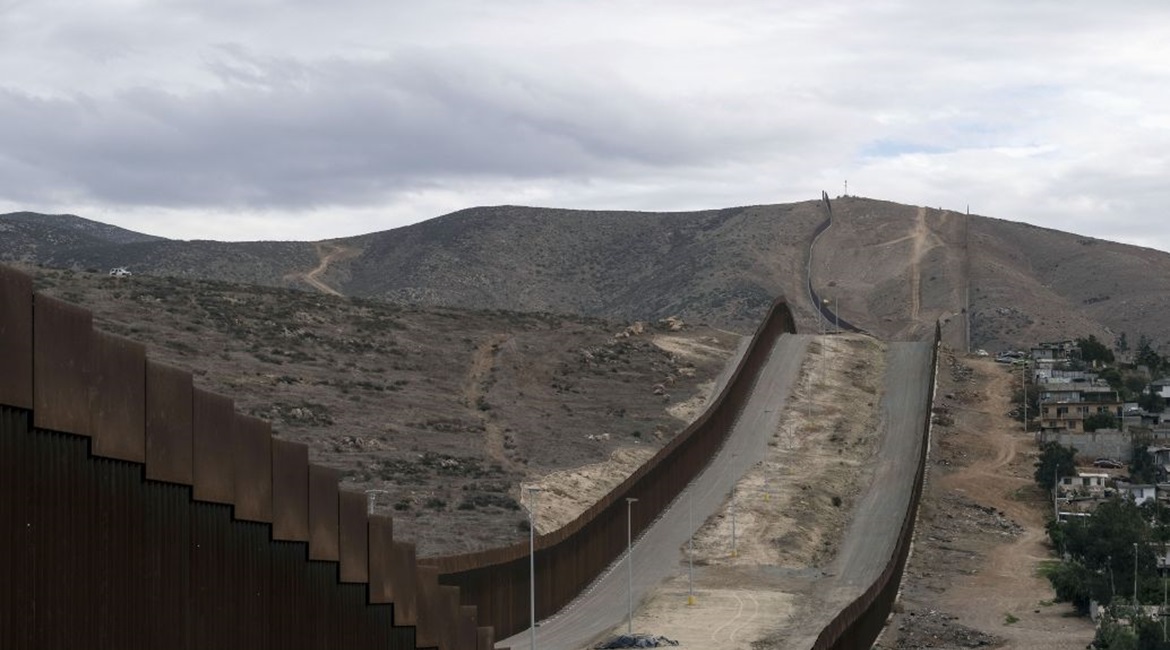 A section of the US-Mexico border wall runs alongside Tijuana, Baja California state, Mexico, on 20 January 2021. Under President Joe Biden, US border security policies are likely to become less militarised and more nuanced.