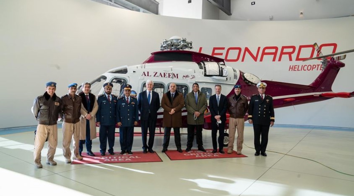 Qatari Minister of State for Defence Affairs Dr Khalid bin Mohammed al-Attiyah (fifth from right) stands in front of a AW169 painted in the colours of Qatar's Al-Zaeem Air College.