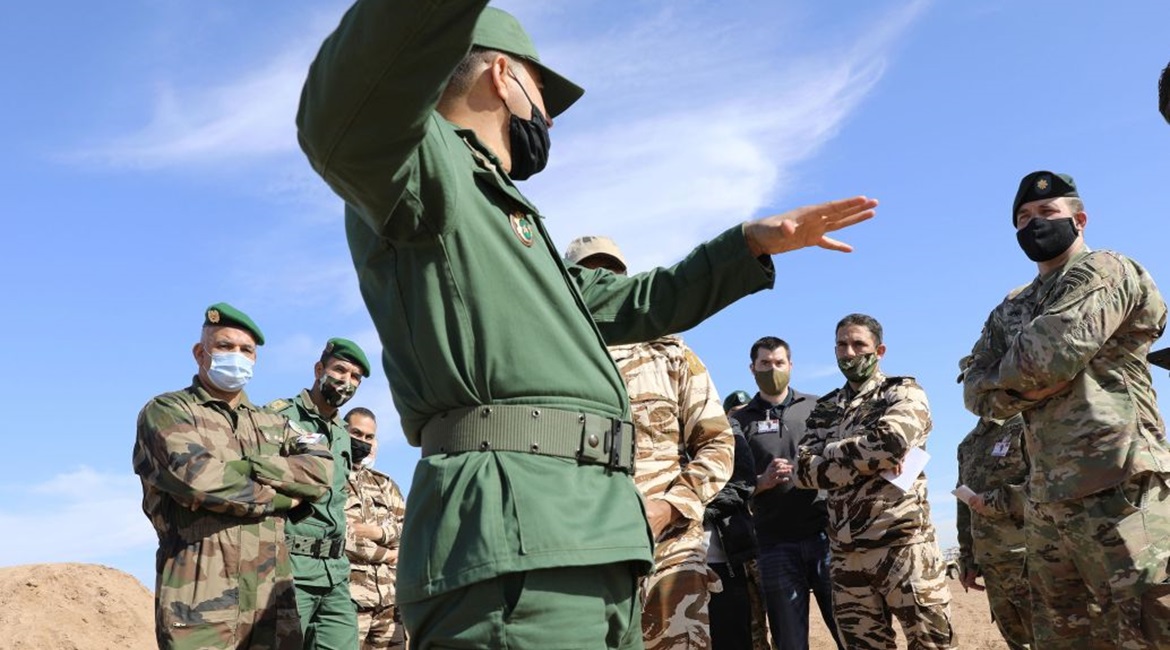 An officer with the Royal Moroccan Armed Forces explains the capabilities of firing at range during a site survey in preparation for African Lion 2021.
