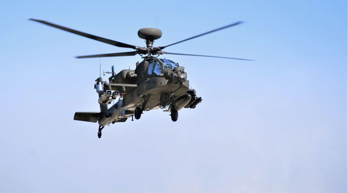 The AH-64E Apache testbed used for the demonstration can be seen with a pair of Spike NLOS missiles on its right-side outer weapons pylon.